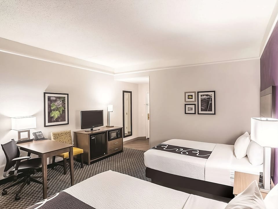 Recharge in a bright double-bed room with blackout drapes.