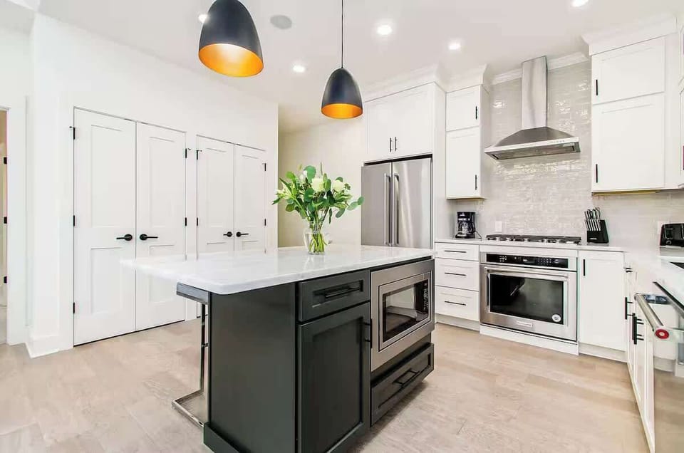 From the gleam of stainless steel to the charm of well-stocked cabinets, this kitchen is a chef’s dream