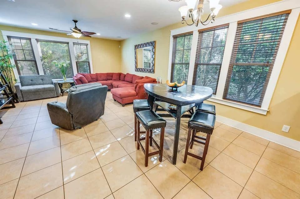 - Open-concept living space with plenty of seating, natural light, and a cozy feel - Enjoy meals at the stylish dining table or relax in the comfortable lounge area - Large windows bring in fresh air and scenic views for a refreshing stay