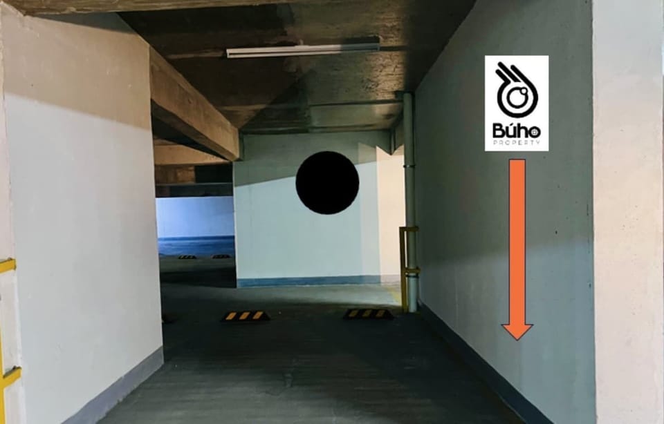 Covered parking garage w/ clearly marked access & entry ramp