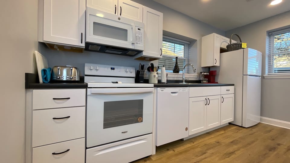 Whip up your favorite meals in this fully equipped kitchen, complete with an oven, fridge, and all the essentials!