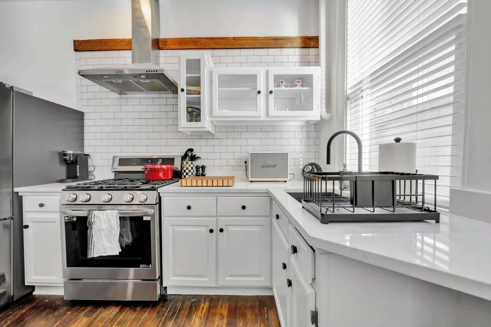 First unit - Modern fully equipped kitchen featuring stainless steel appliances, sleek countertops, ample cabinetry, and all the essentials for effortless cooking and entertaining.