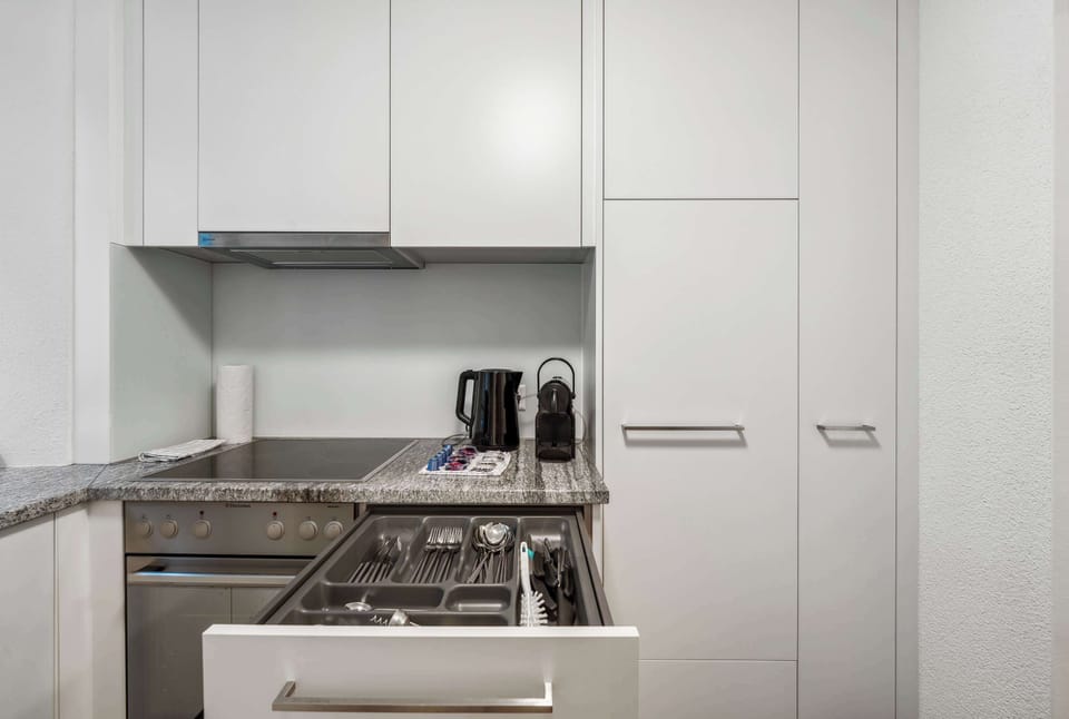 Countertop area with microwave and Nespresso coffee machine.