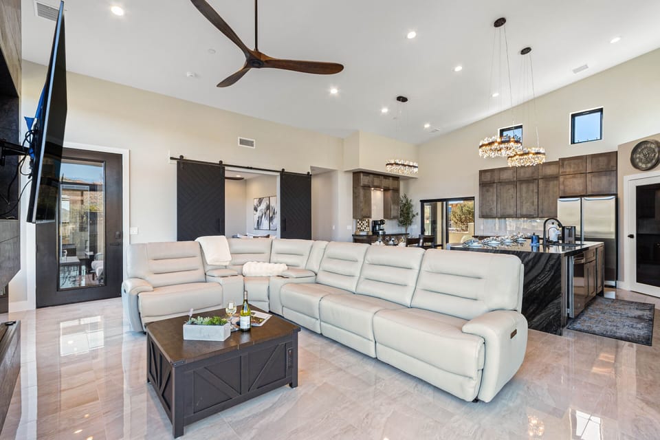 Spacious leather sectional sofa with 3 zero-gravity recliners and built-in USB charging ports.