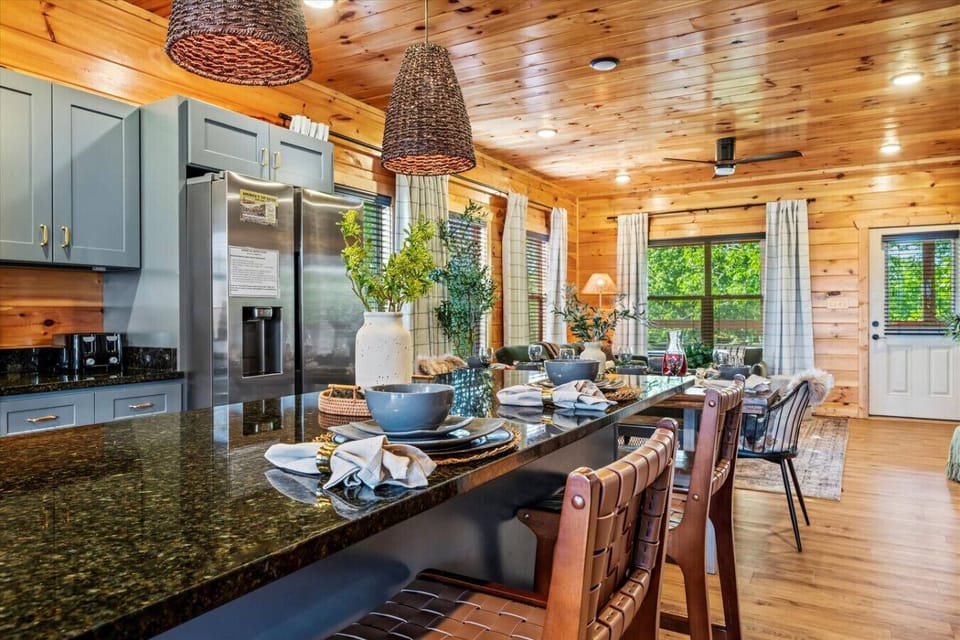 The oversized kitchen island provides plenty of extra space for meal prep, takeout, or laughter with loved ones.