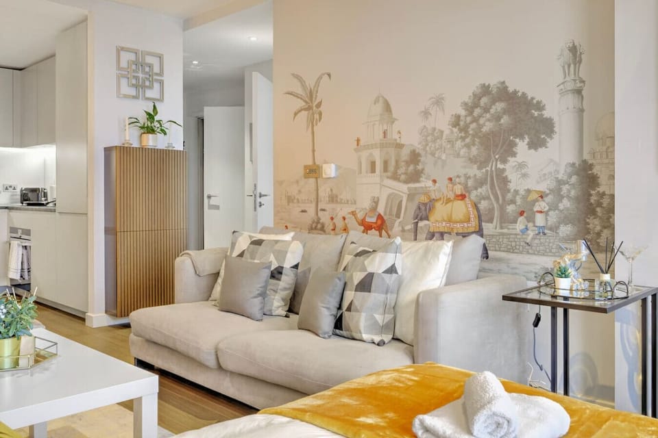 Tasteful living room with a mix of modern furniture, including a cozy sofa and cozy accents.