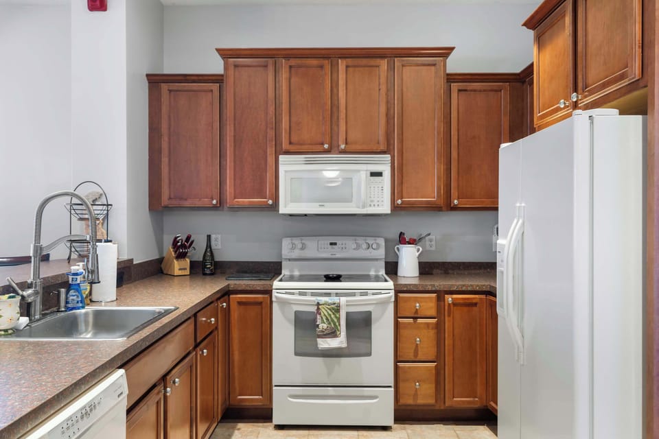 The open, airy kitchen offers ample space & all the comforts of home