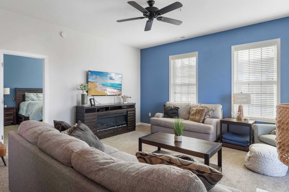 Curl up in the coastal chic living room & enjoy a movie night at home