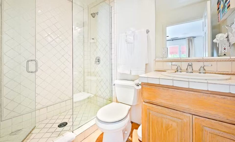 En suite bathroom in dorm bedroom with walk in shower.