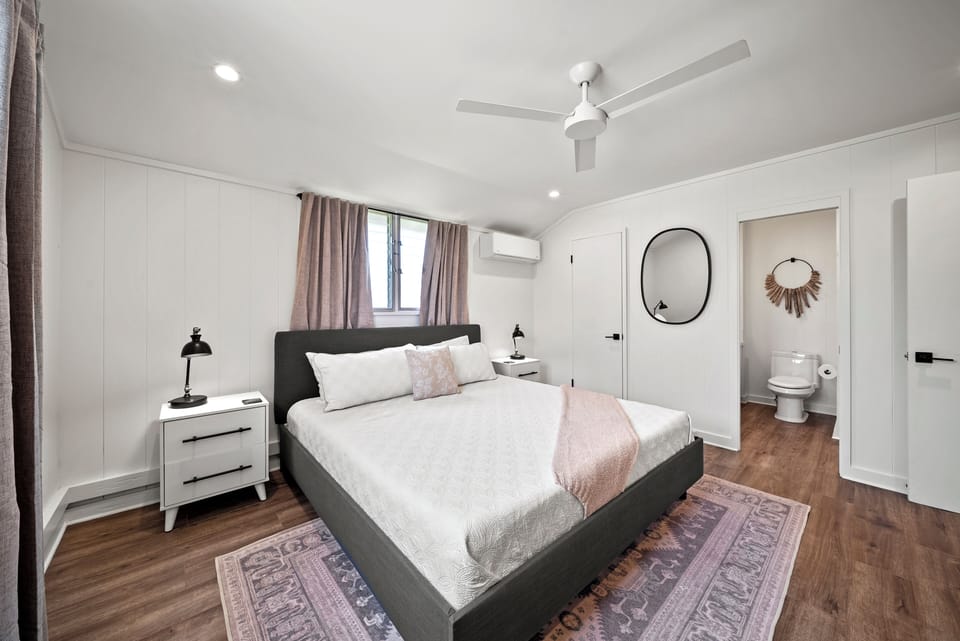 Chic guest suite featuring a king-sized bed, soft neutral tones, and thoughtful finishes for restful nights.