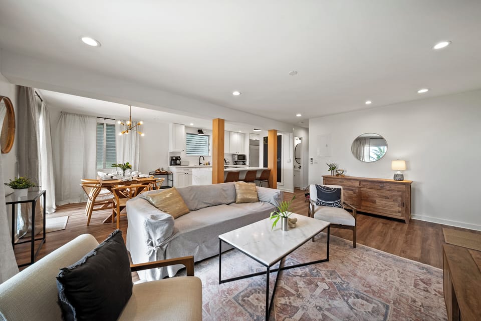 Living area featuring a comfortable leather sofa and a large coffee table.