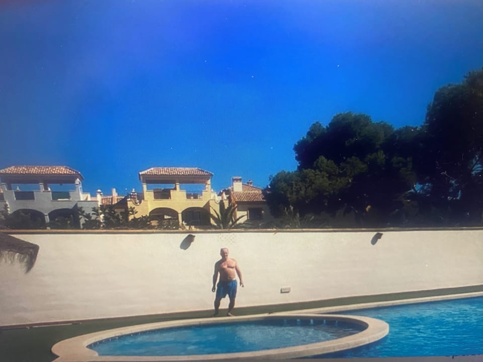 Pool with penthouse apartment in the background