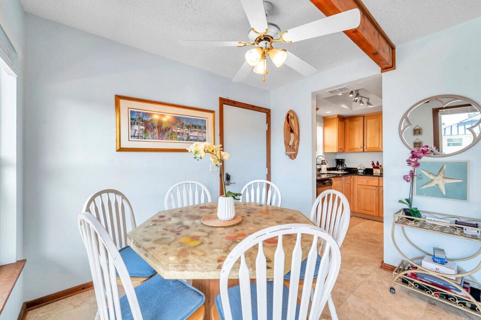 Bright dining nook w/ a round table, perfect for shared meals and casual conversations.