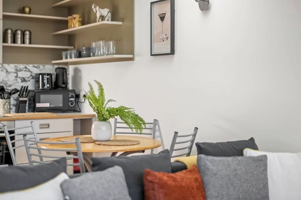 Designed for effortless flow and refined living, this open-concept space harmoniously blends the living and dining areas.
