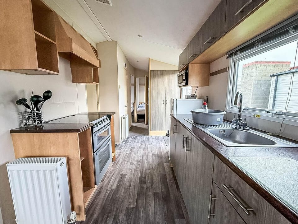 Bright, modern kitchen with ample natural light and storage