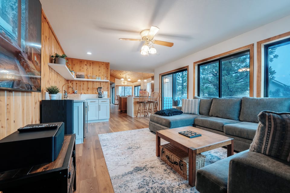 Open floor plan wrapping around into the kitchen and larger family room. 