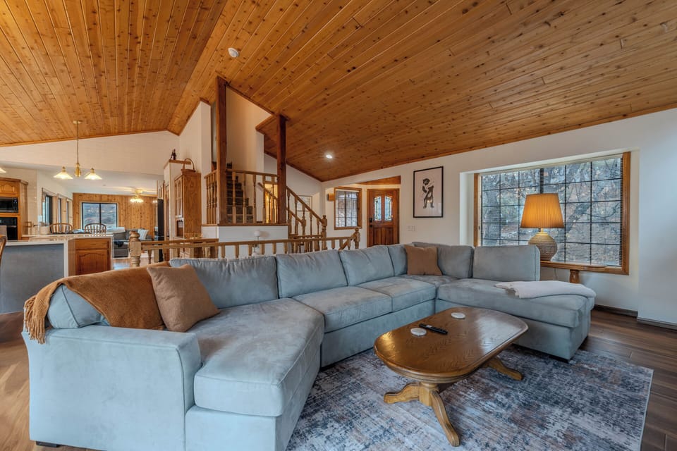 Open floor plan wrapping around into the kitchen and second bonus family room. 