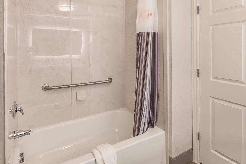 Rinse off and recharge in the clean tub-and-shower combo.