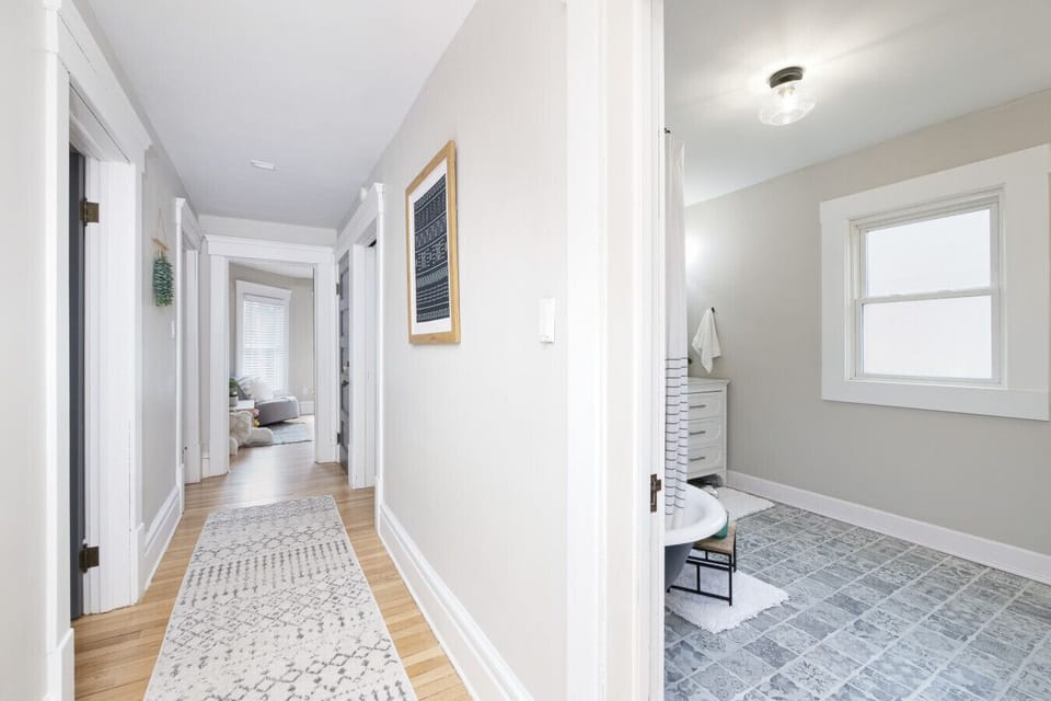 Bright and airy hallway with natural light, hardwood floors, and charming vintage details 🌿🚪 A welcoming path connecting the heart of the home to cozy, private rooms.