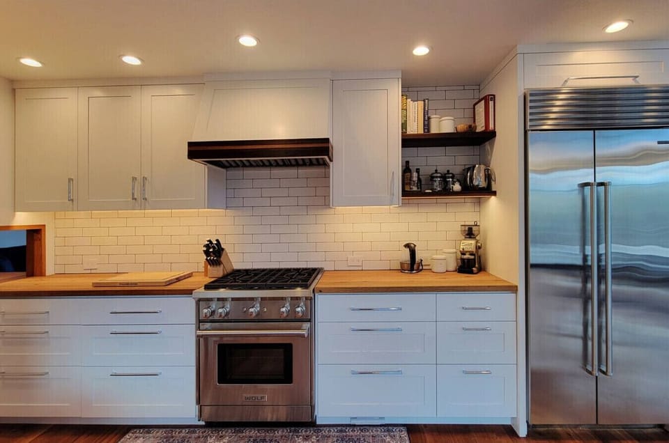 Gourmet kitchen with gas range, warming drawer, and sub zero fridge/freezer