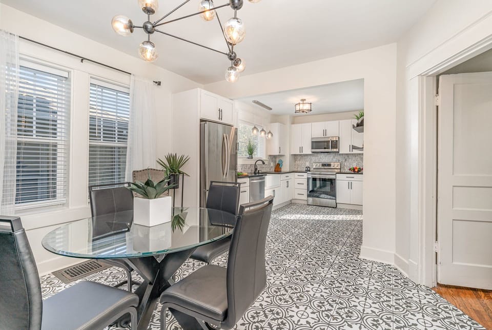 Dining Area with seating for 4 guests between the living area and kitchen.