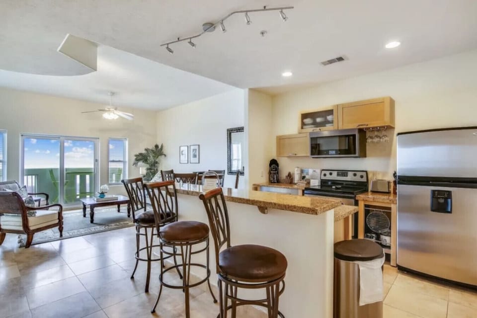 Enjoy dining at the kitchen bar or at the dining table