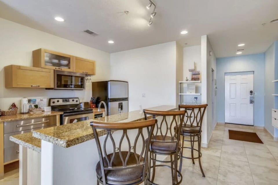 Kitchen and bar are a crossed from king bedroom