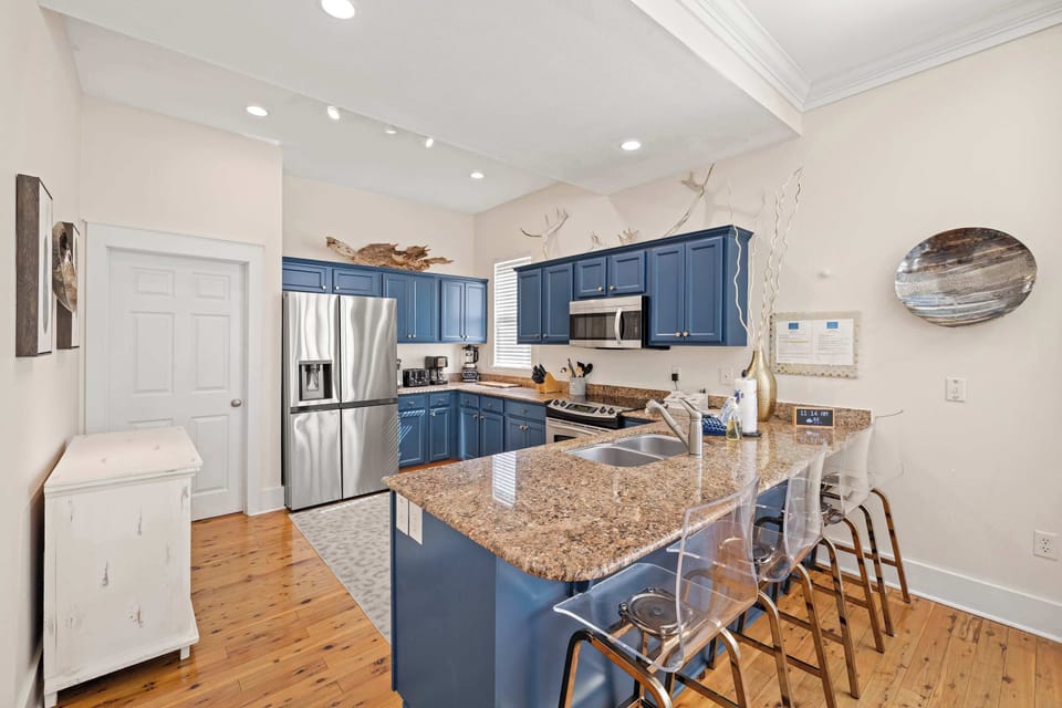 Kitchen: Keurig coffee maker, blender, toaster, toaster oven, cooking utensils, tableware