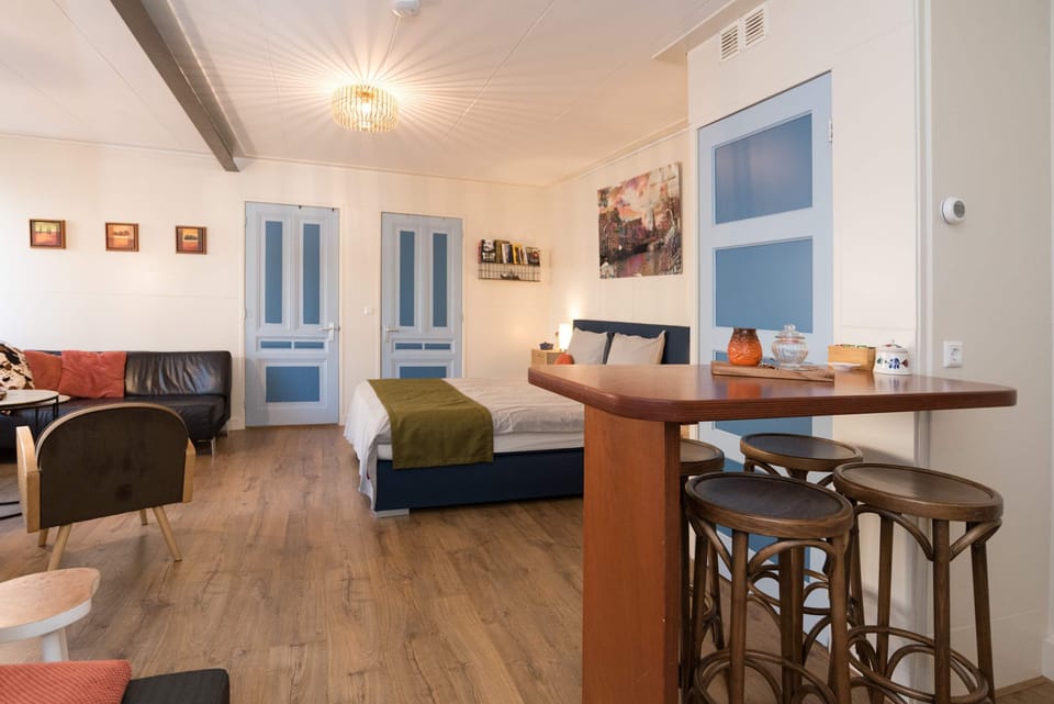 Enjoy a bright and stylish living space with a comfortable double bed, perfect for relaxing after a day in Alkmaar.