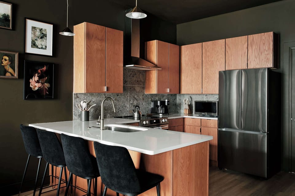 Cook and entertain in this stylish kitchen, complete with sleek appliances, a roomy island, and designer finishes throughout.