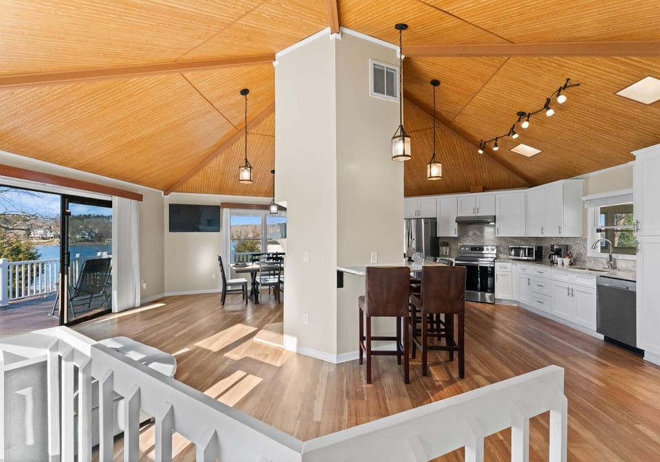 Unique round main level with kitchen, living, dining and counter seating. 