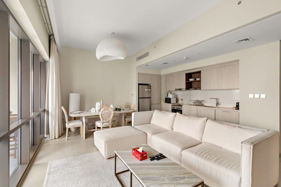 Living Room: Sun-drenched space with chic furnishings and a stylish dining area for memorable meals!
