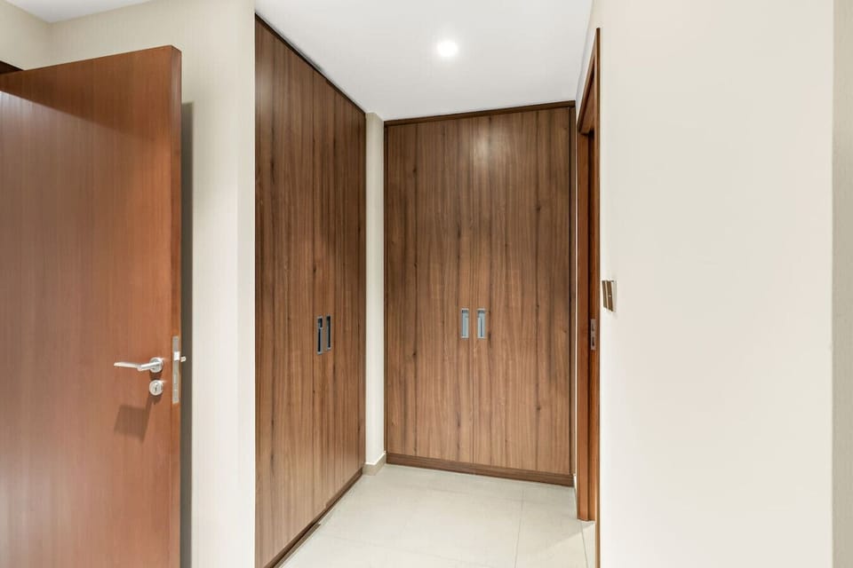 Entryway: Stylish and functional space welcomes you with sleek cabinetry and modern design!
