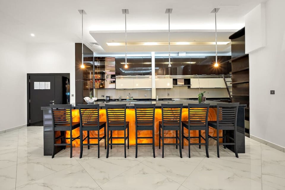 Stylish Kitchen: Culinary adventures await at this modern space with sleek décor and glowing ambiance!