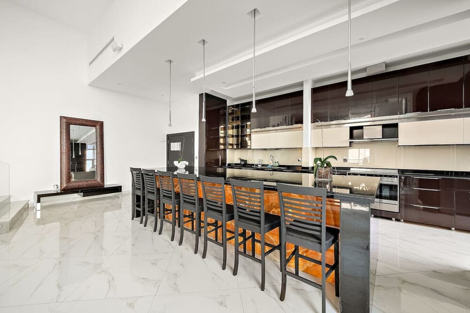 Kitchen: Enjoy gourmet cooking in this elegant space with sleek design and modern finishes!
