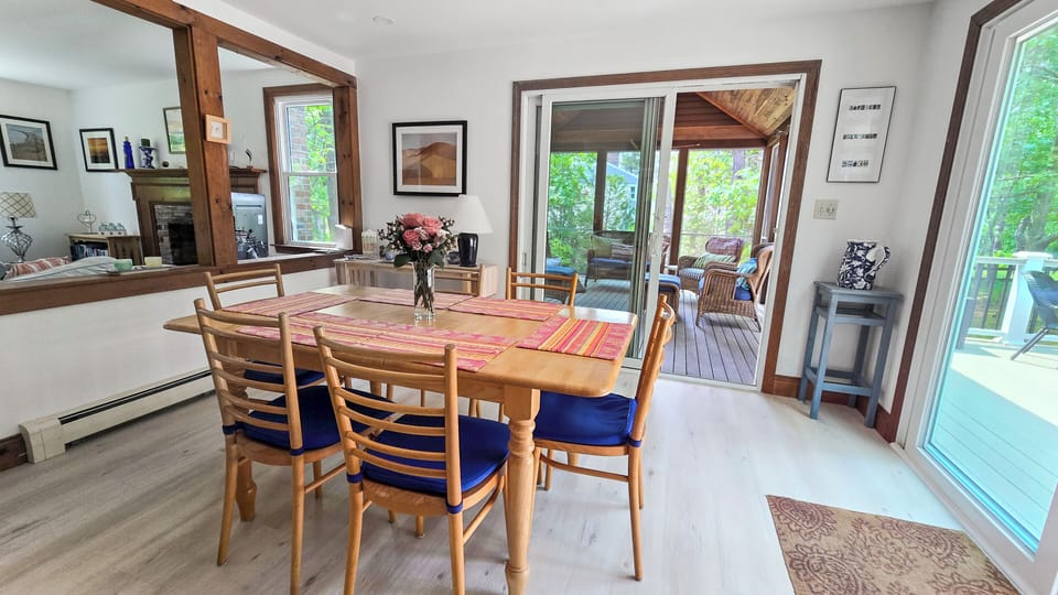 Dining room with sliders to deck and screened-in porch