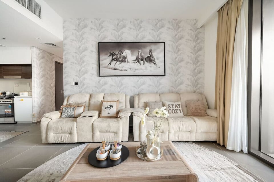 Living Room Retreat: Stylish seating and serene decor create a perfect space to unwind and relax!