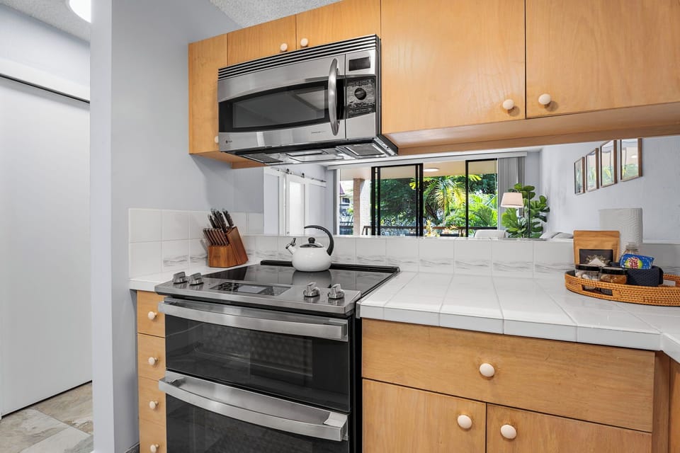 Cozy kitchen featuring a full stove and functional counter space.