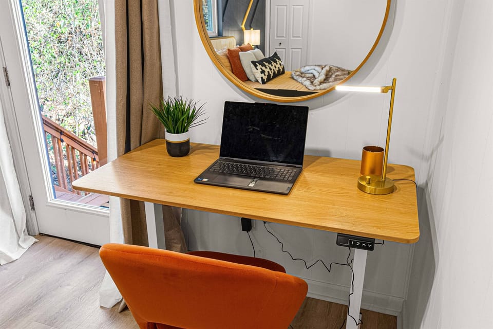 Main bedroom with a cozy workspace, perfect for remote work or catching up on emails.