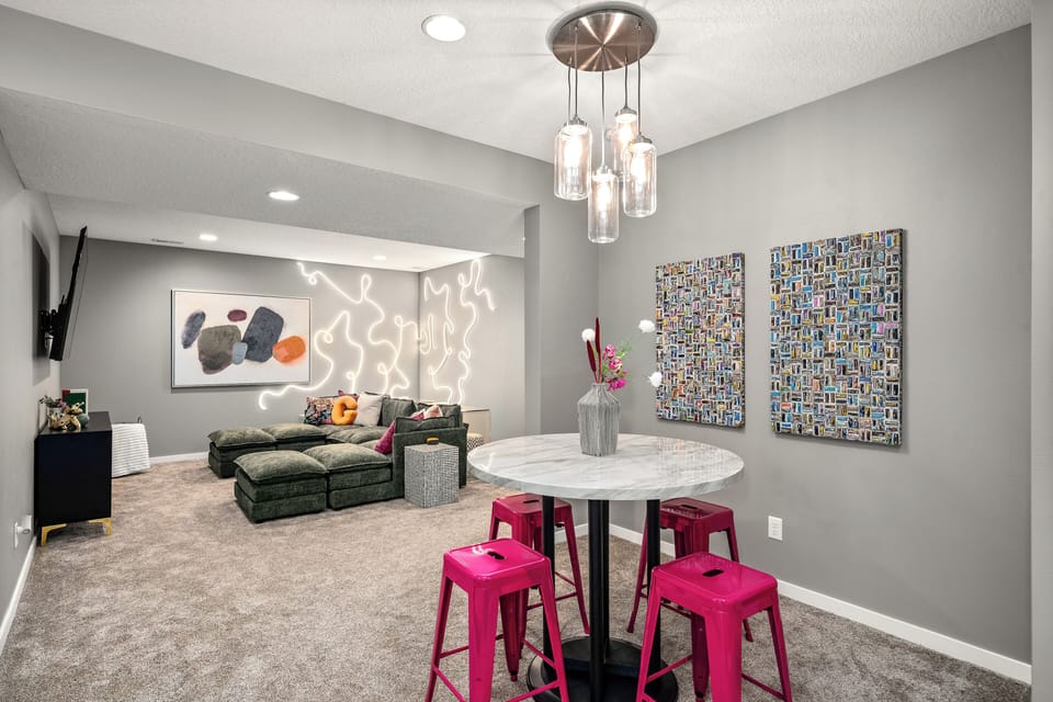 This basement space is perfect for playing games or watching the 75" TV!