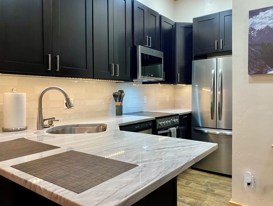 Newly designed kitchen with full appliance package counter seating