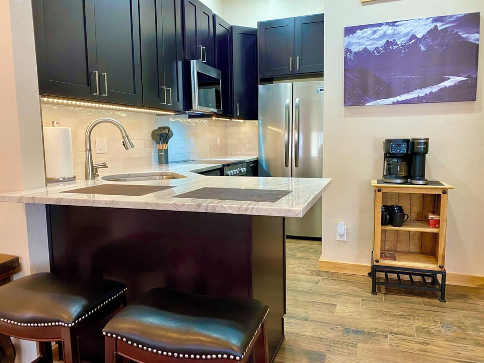 Newly designed kitchen with full appliance package counter seating
