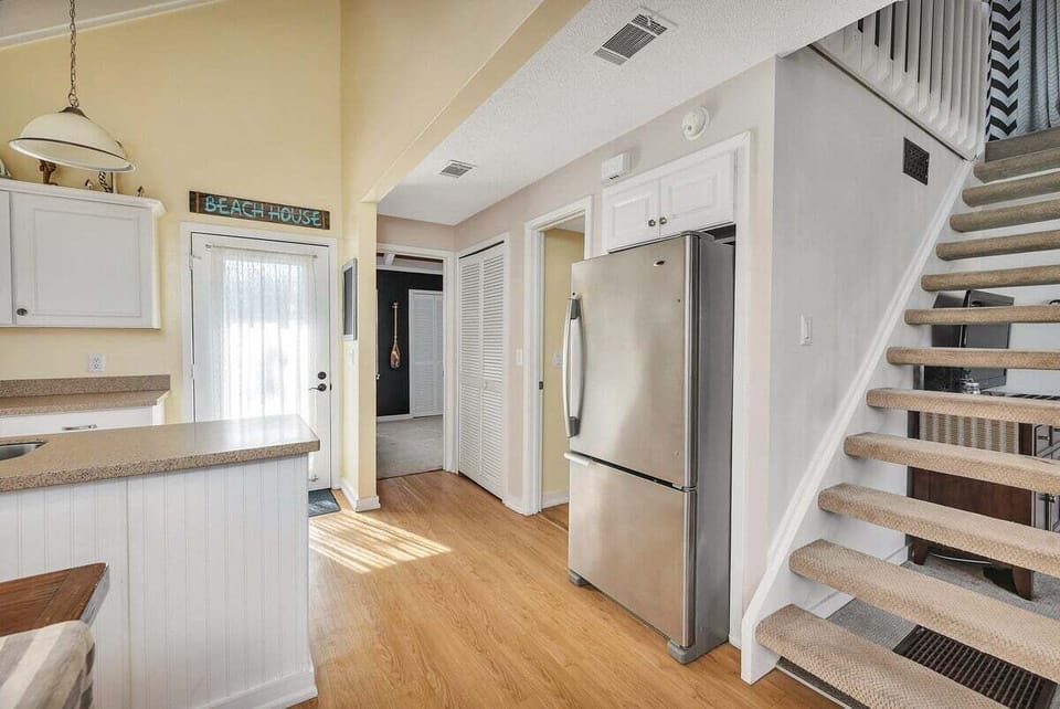 Hallway to kitchen and staircase