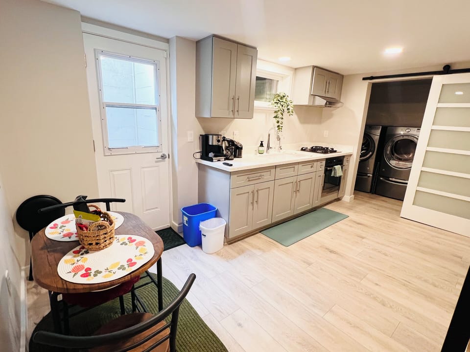 Kitchen with small breakfast area, gas stove, electric fireplace