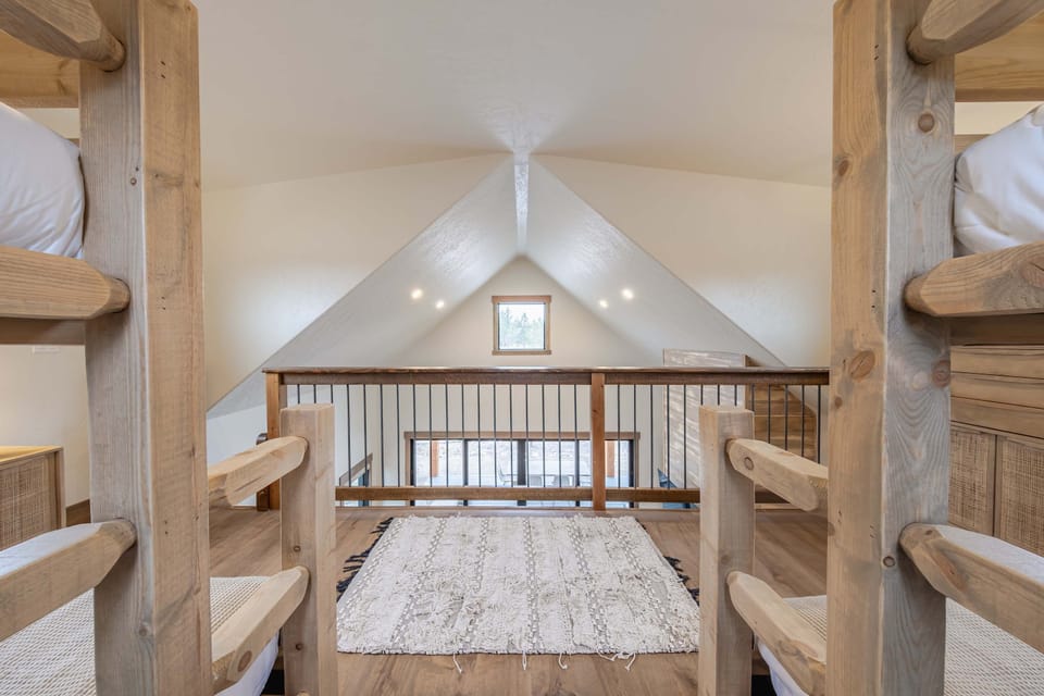A pair of comfy full-over-queen bunkbeds is available in the loft
