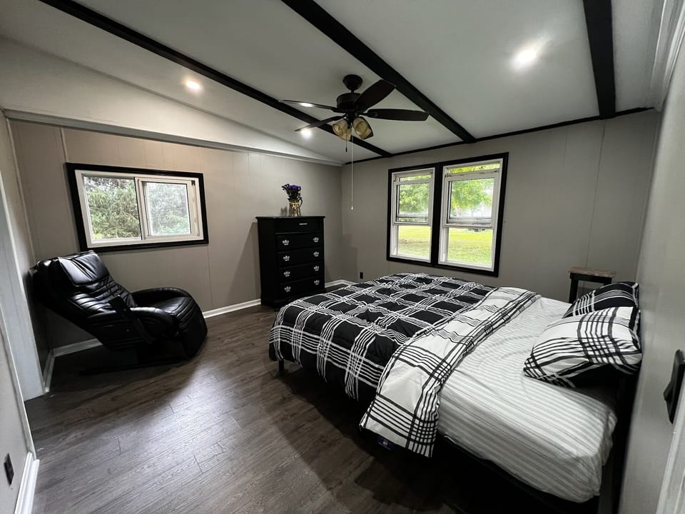 Relax & recharge in the comfortable bedroom with massage chair.