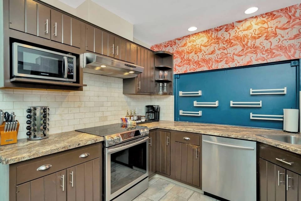 The kitchen has a breakfast bar to seat 4 people (two in the kitchen and two in the living room). We provide all silverware, dishware, spices, and utensils for great homemade meals.