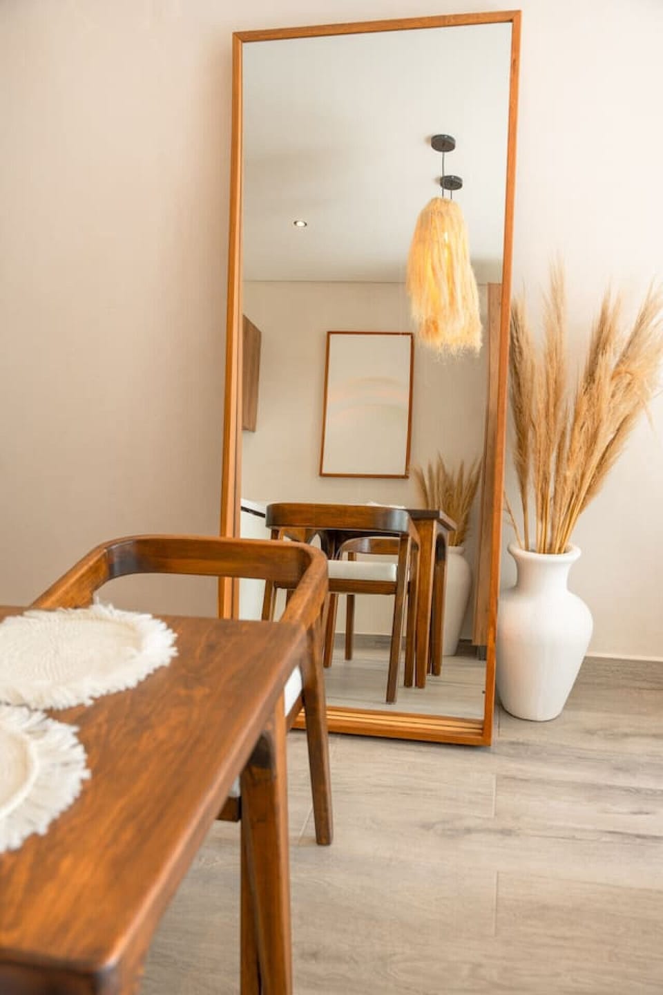 Studio with TV, dining area, bed, and balcony view.