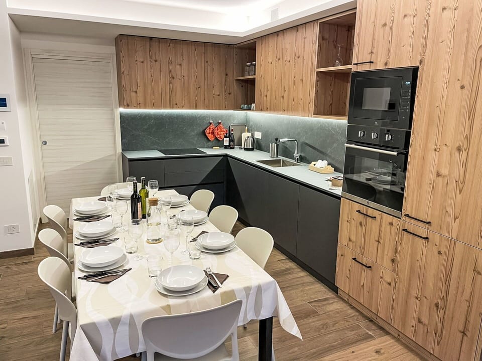 Kitchen, Countertop, Flooring, Wood, Furniture, Interior Design, Kitchen Appliance, Cabinetry, Major Appliance, Floor