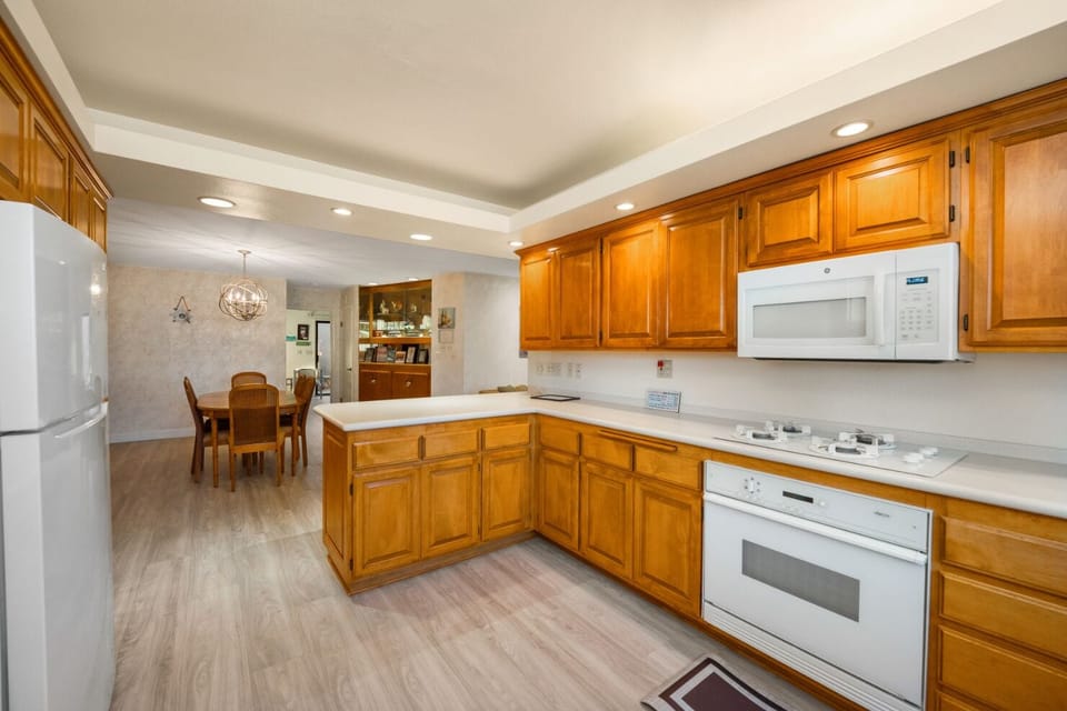 Modern kitchen and dining area come together for the perfect cooking and dining experience.